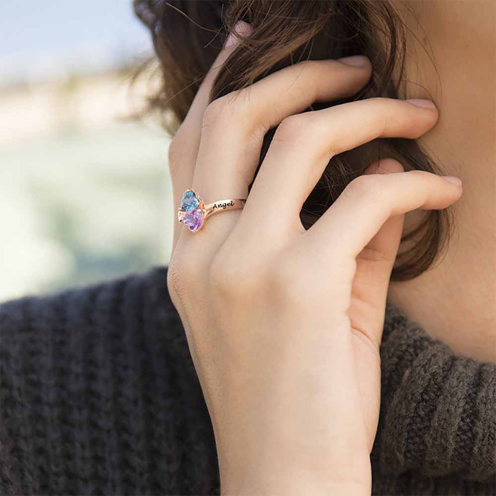 gold band with 2 heart shaped stones on models hand My Keepsake Story